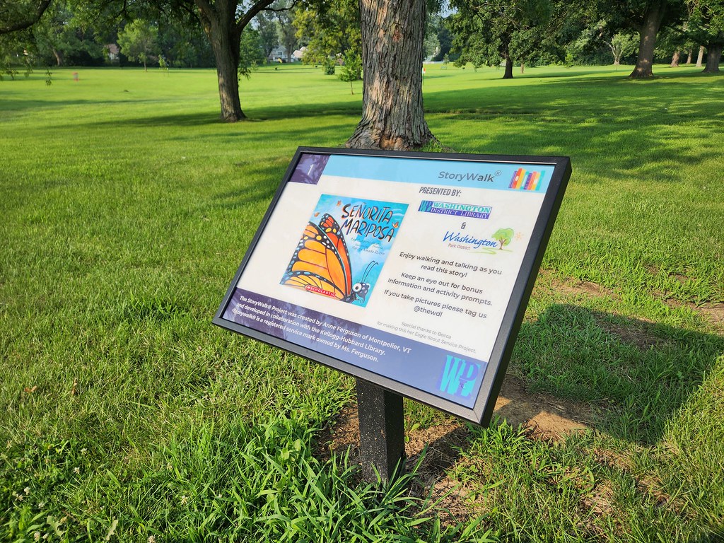 Photo of the StoryWalk in Washington Park featuring the book Señorita Mariposa by Ben Gundersheimer.